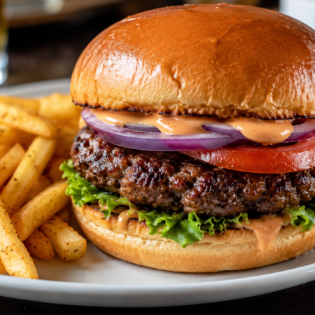 Beef burger with fresh beef patty, and veggies.